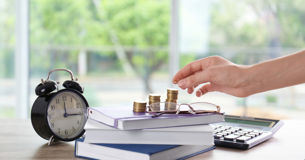SMSF Property - Self Managed Fund - Person Putting Coins over 3 books with a clock beside and a calculator as well